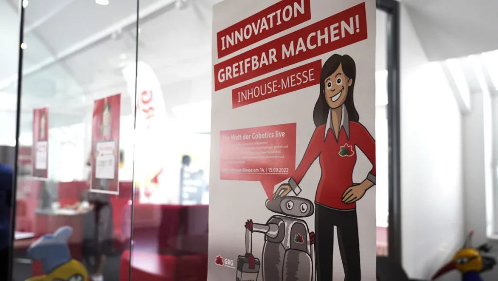 GRG Cobotic Inhouse-Messe 2022 Plakat mit Reinigungsroboter Lola - Innovation in der Gebäudereinigung Berlin